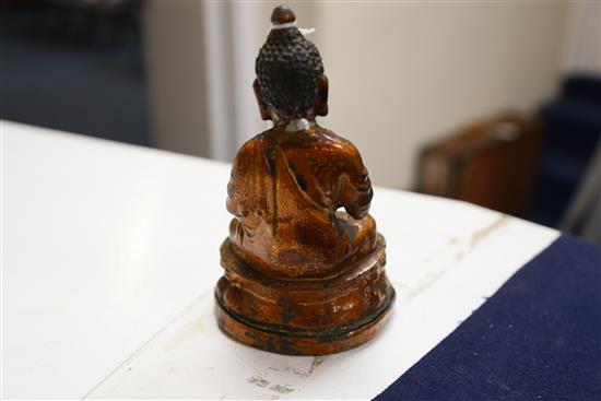 A Chinese gilt lacquered bronze figure of Buddha, 18th/19th century, H. 7.3cm, repair to neck